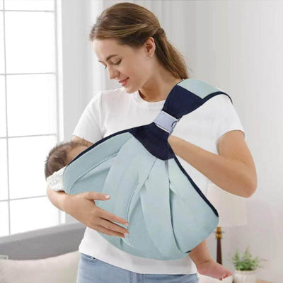 maman porte bébé avec écharpe de portage babymov
